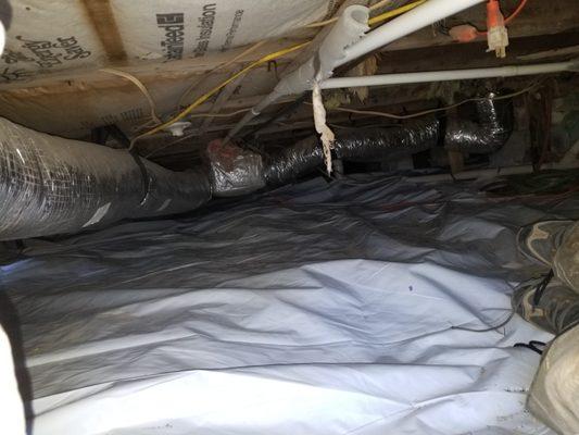 Laying vapor barrier in crawl space