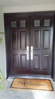 New customer metal door with a wood look double doors