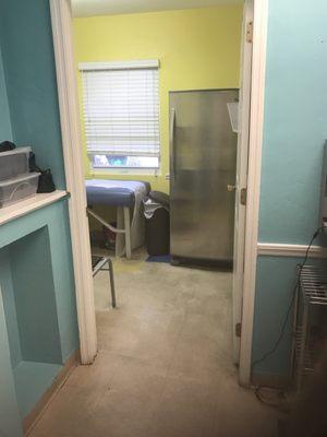 The floors, baseboards and counters are filthy! the fridge in this exam room clearly did not have its outside cleaned inquite some time!