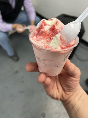 Strawberries and cream on top of gansito (cherry? with chocolate covered sweet bread mixed in)