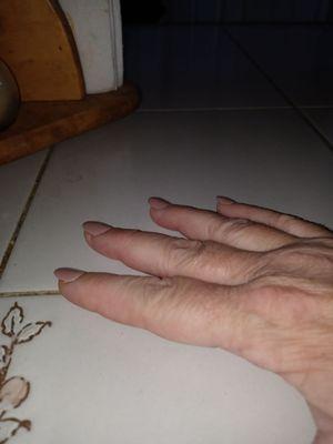 Manicured hand.