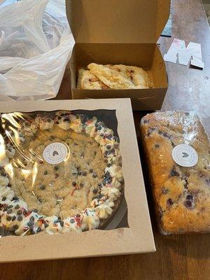 Celebration cookie, lemon blueberry bread, and peach scones.