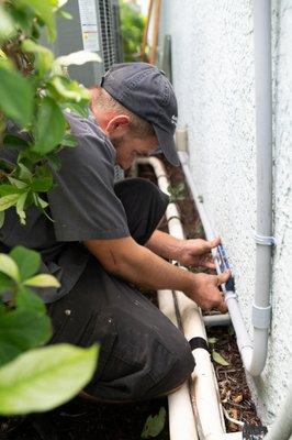 An Air & Energy technician installs a brand new Trane air conditioning system.