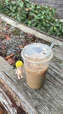 sonny angel next to my iced oatmilk english toffee latte