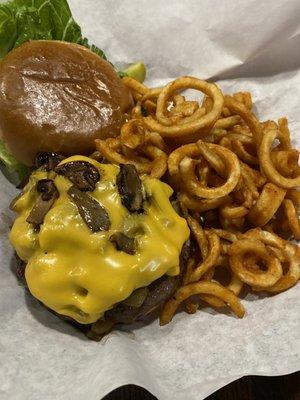 Burger medium rare with curly fries