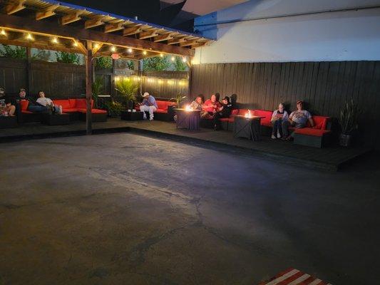 Patio with Tvs, and Food Trucks.