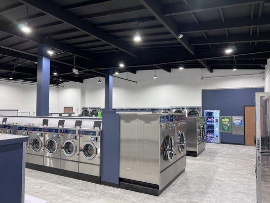 Very spacious and clean facility with a large variety of new industrial washers and dryers. Each machine takes coin or credit card.