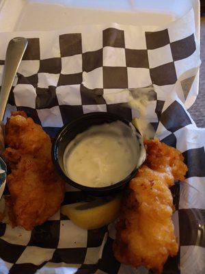 Two of the four pieces of fish and the tartar sauce.