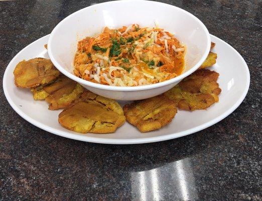 TOSTONES fried green plantains serve with shredded chicken