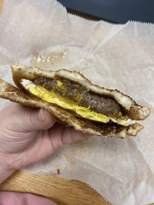 Neese Sausage with fried egg and cheese on toast