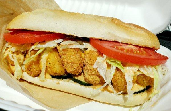 The Shrimp Po'Boy  - Large shrimp, spicy sauce, and zesty pickles.