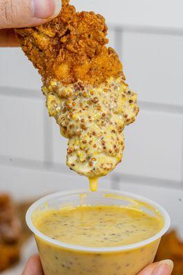 Tenders dipped in our homemade honey mustard sauce