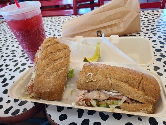 Large sub, pickle and drink