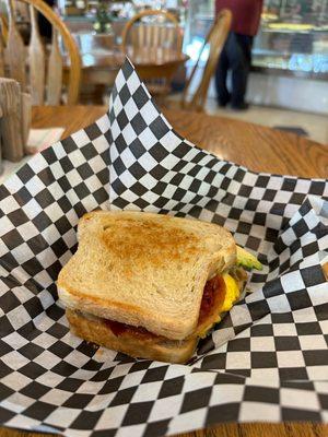 Custom Breakfast Sandwich. Sourdough, egg, bacon, and avocado