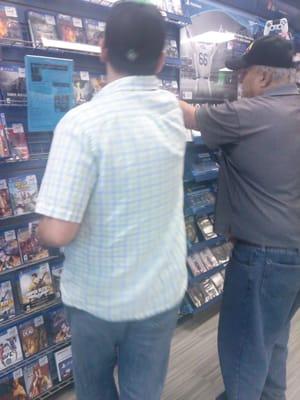 Hubby and Dad picking out games.