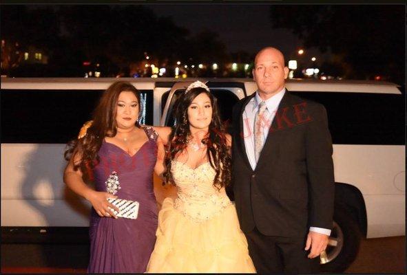 One of our limousine customers arriving to her Sweet 16 in style with our White 14 Passenger GMC Limousine.