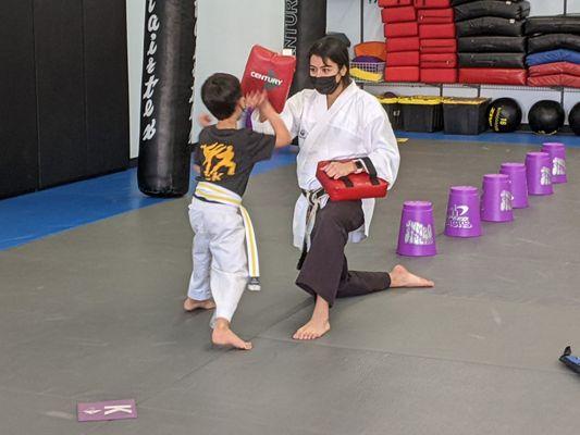 5 year old having fun and learning at Encinitas Karate