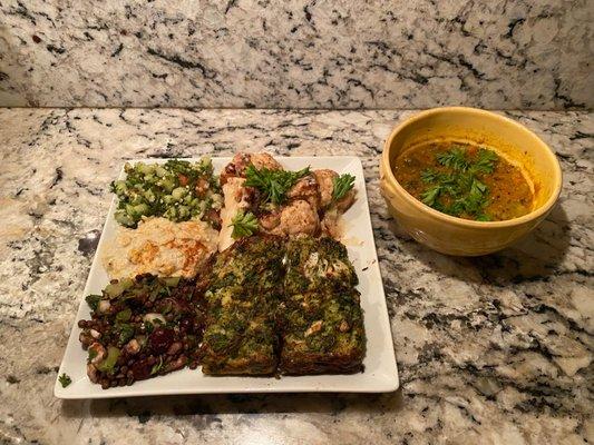 Tabouli quinoa, cauliflower in a tahini sauce, babaghanoush, black lentil salad, broccoli latke, and split pea soup