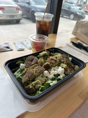 Falafel salad and fruit salad.