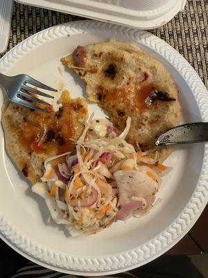 Pupusa dressed with Salvadoran slaw (called curtido) and salsa. Yum!