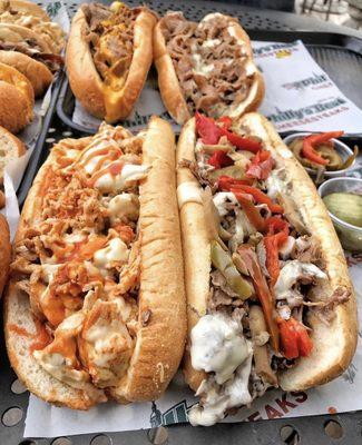 Buffalo chicken and cheese. Phillys Best cheesesteak which includes grilled sweet bell peppers, and mushrooms