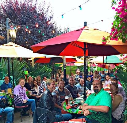 Family, friends, and food at a monthly birthday dinner celebration.