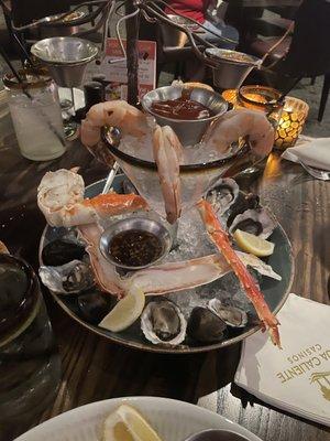 Seafood tower for $45. Came with 4 shrimp, 2 crab legs, like 4 oysters and such