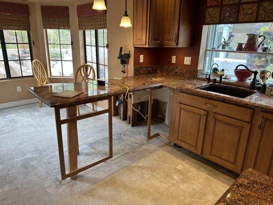 Laminate Floor has been removed, my Granite is in tact as they removed 2 under cabinets, and some drywall. No mold or mildew anywhere!