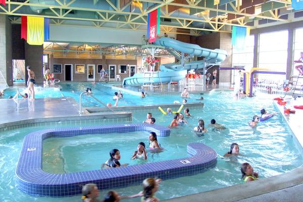 Indoor Recreation Pool with slide, current canal and water play features.