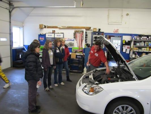 Demonstrating things under the hood during our car care clinic.