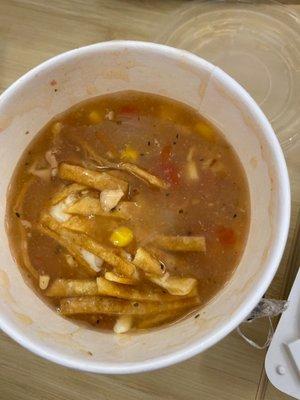 Chicken tortilla soup with cheese.