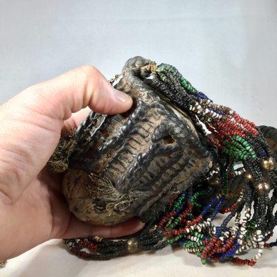 Tribal Necklace from Laos, featuring a large seed woven in leather.