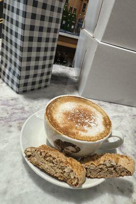 Cappuccino with some biscotti.