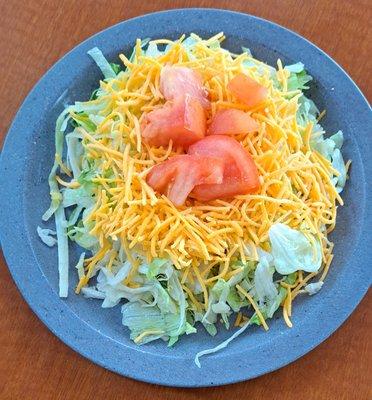 Shredded lettuce, cheddar cheese and tomatoes