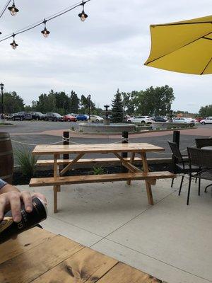 Patio has picnic tables and umbrella tables.