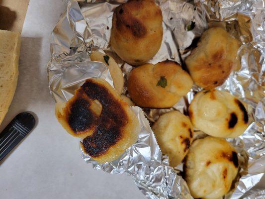 Burnt garlic knots. I understand they baked in an over, but to totally burn a bottom & singe 3 is not great.