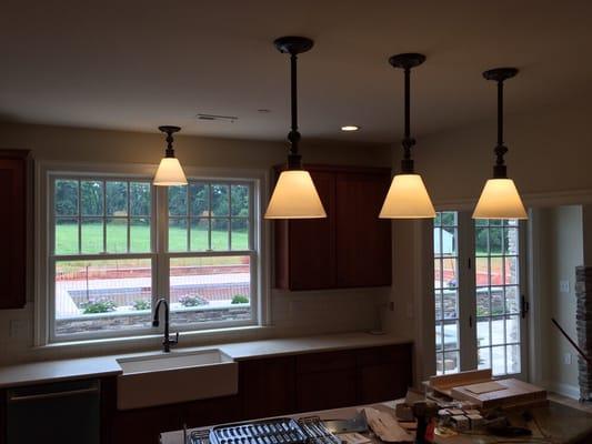 Large pendant fixtures in a pretty big kitchen