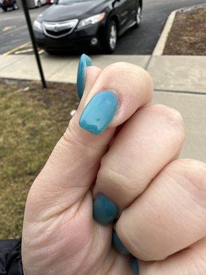 Crappy polish application, crack/scratches on freshly done nails. Nails were not cut down or teal like I asked for.