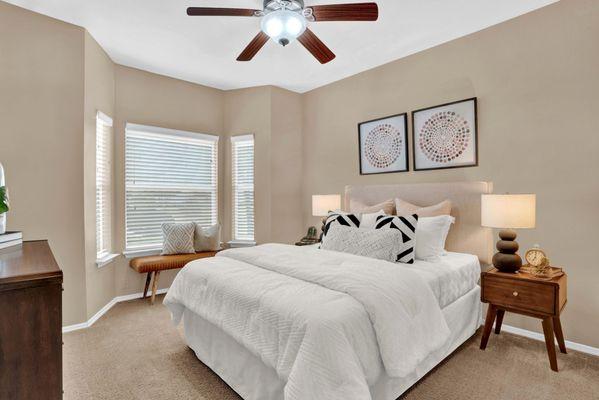 Bedroom with ceiling fan at Villas at Preston Creek