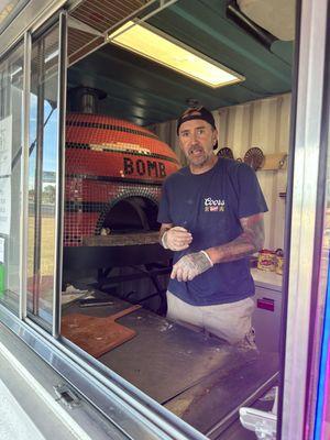 Chris the owner and wood fired pizza oven from Trinidad