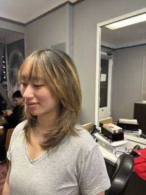 Wispy bang with medium layer haircut