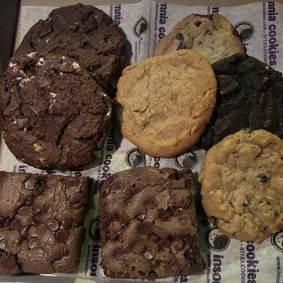 Top left: deluxe s'more cookies, lower left: chocolate chip brownies, 4 on right are their regular sized cookies