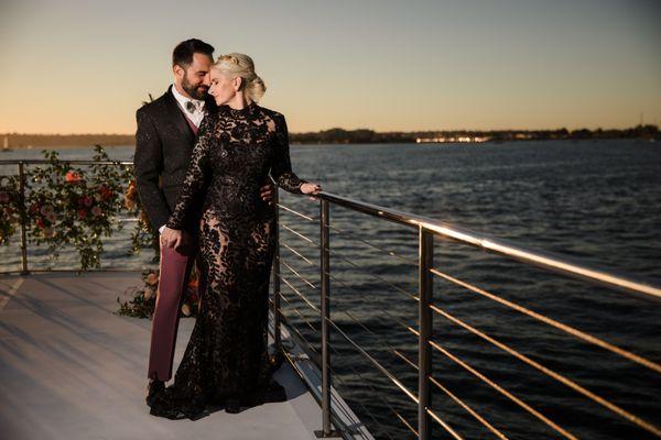 Planner @lizzylizevents  Yacht @legacycruisessd Black Lace Dress @laguna_bridal @teranicouture Florals @honeybearevents