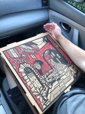 Large pepperoni pizza box (arm for size reference)