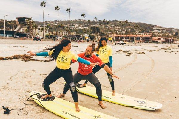 Learning the basics of surfing before jumping in the ocean