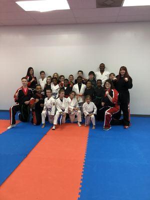 Students who just completed strips and new belts