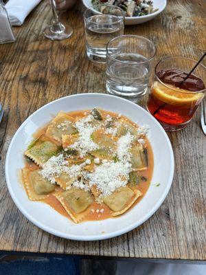 Spinach ricotta ravioli with tomato oil. Negroni Sbagliato