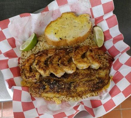 Blacken 1 catfish 6 shrimp over Cajun rice served with limes toast and your choice of two dips