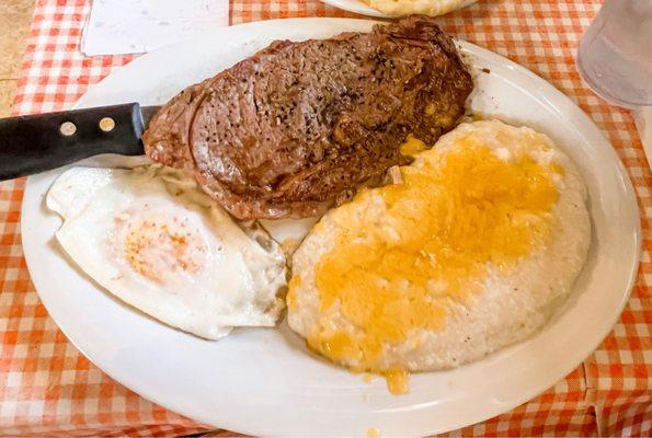 Steak and egg breakfast. With cheese grits