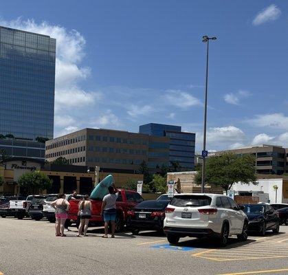 Curbside parking is full w/no one in their cars! The guy w/the canoe waited for help to arrive to load by his friends, not staff.